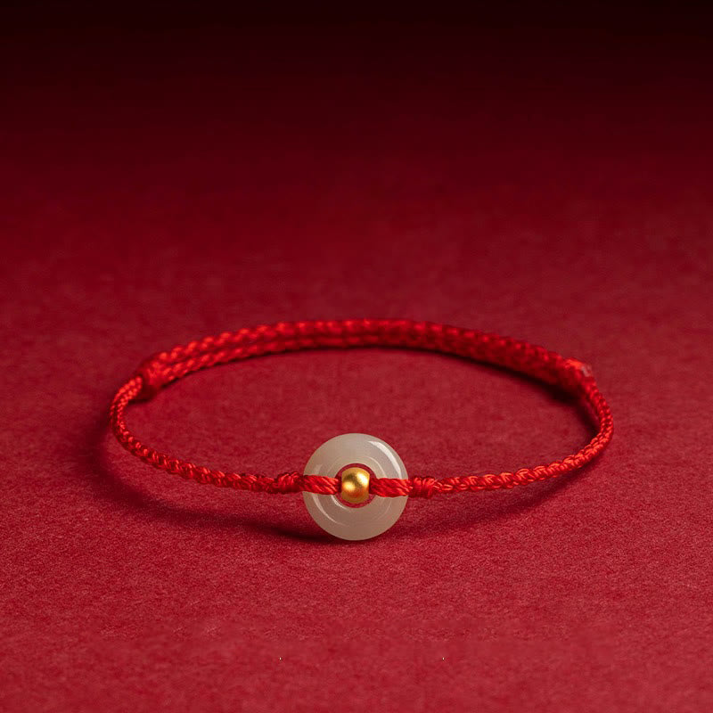 Glücksarmband aus 999er Goldperlen aus Hetian-Jade mit Friedensschnalle