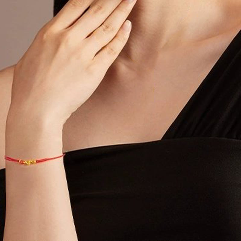 999 Gold Schlangenarmband mit roter Schnur für 2025