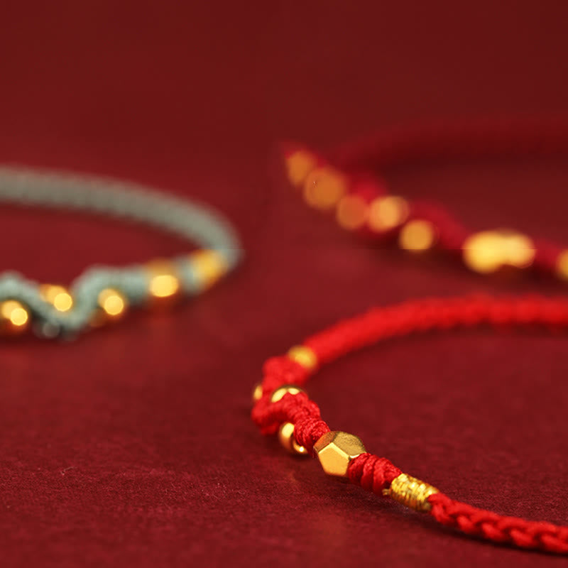 999 Gold Schlangen-Schutzarmband mit roter Schnur
