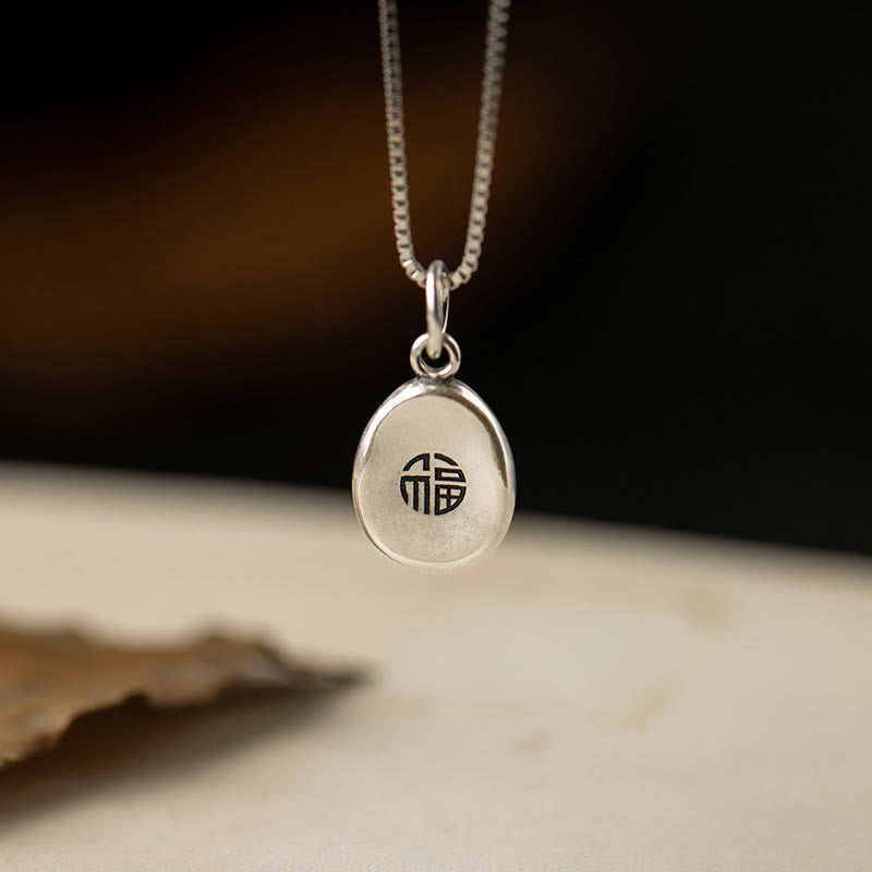 Spirituelle Halskette aus 999er Sterlingsilber mit Peace Joy Fu-Anhänger