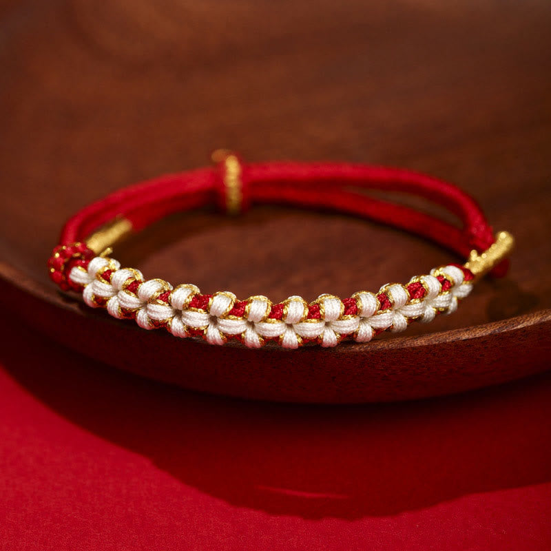 Verstellbares Armband aus rotem tibetischem Goldfaden mit Pfirsichblütenknoten