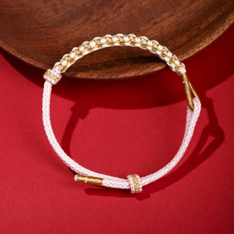 Verstellbares Armband aus rotem tibetischem Goldfaden mit Pfirsichblütenknoten