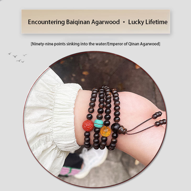 Adlerholzarmband mit türkisfarbenem Bernstein und rotem Achat für Stärke