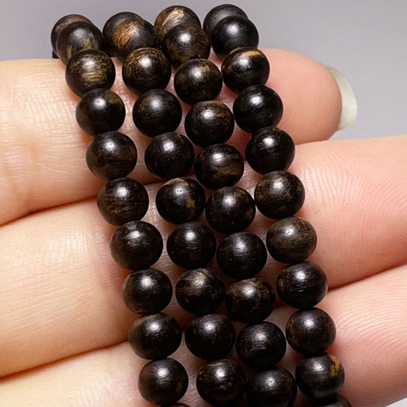 Adlerholzarmband mit türkisfarbenem Bernstein und rotem Achat für Stärke