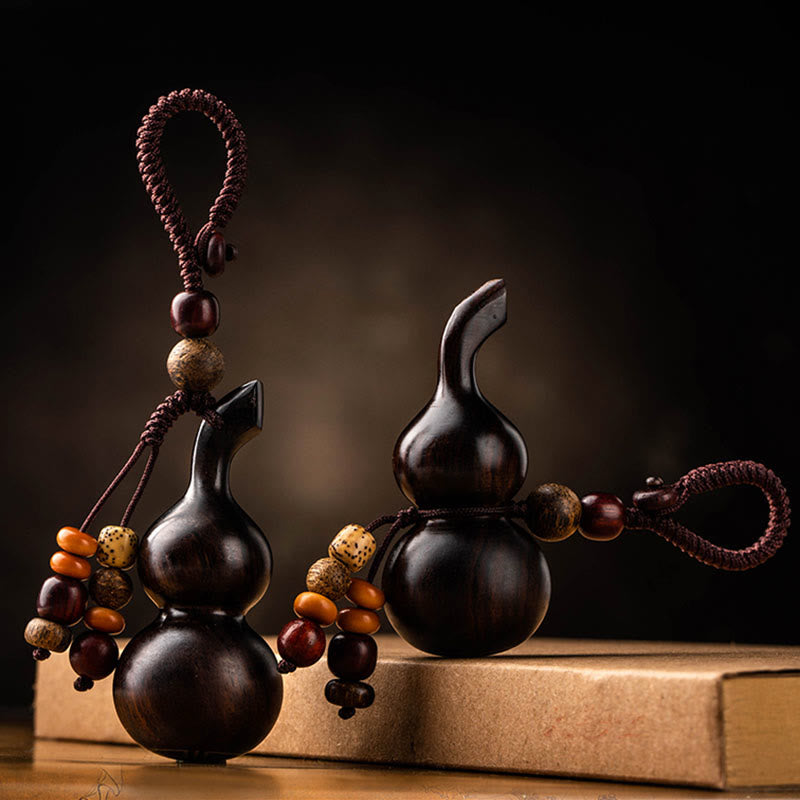 Schlüsselanhänger aus Kürbis aus Ebenholz und rotem Sandelholz für Glück und Schutz