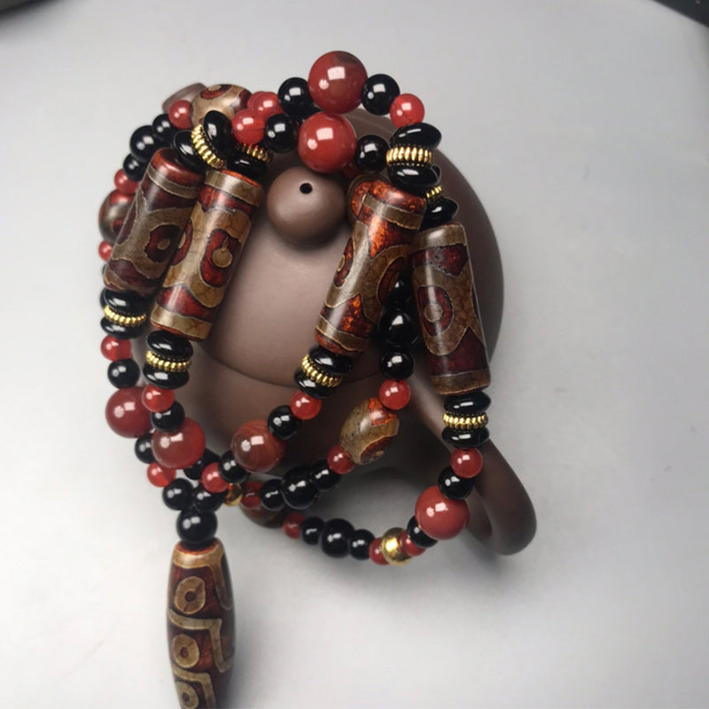 Neun-Augen-Dzi-Perle, roter Achat, 9 x 12 mm, Reichtumskette