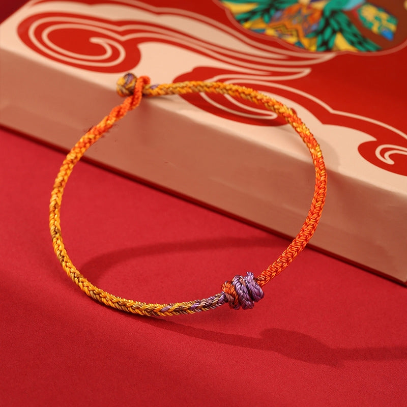 Buntes lila-goldrotes geflochtenes Seilarmband für Balance