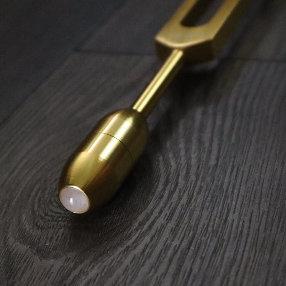 Gold-colored tuning fork with cylindrical weight for Crystal and Onyx Massage Handles