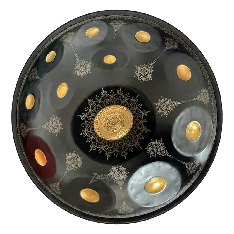 Circular black D Minor Kurd handpan drum with golden accents and mandala patterns