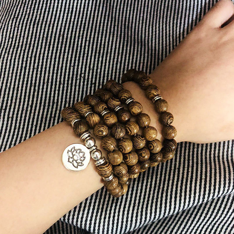 Handgefertigtes Mala-Armband aus Holz mit Blitzschlag und Lotus-Buddha-Symbol