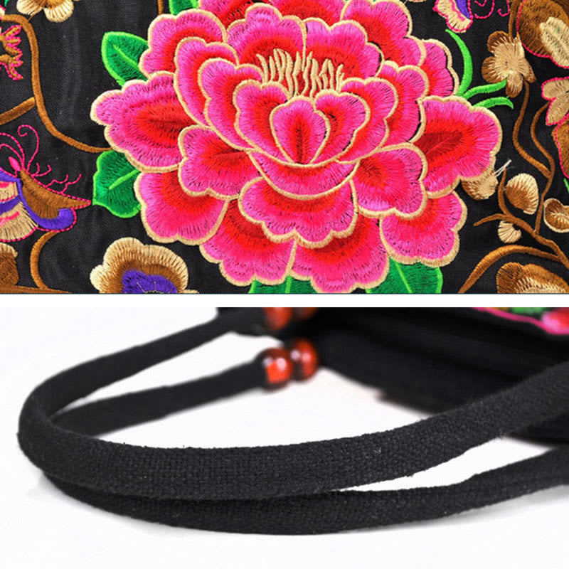 Doppelseitig bestickte Handtasche aus Baumwoll-Canvas mit Wohlstandssymbolen