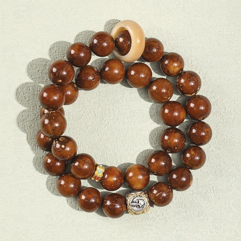 Doppelt gewickeltes spirituelles Armband mit Rattenreichtum und Bodhi-Samen in Lila und Gold