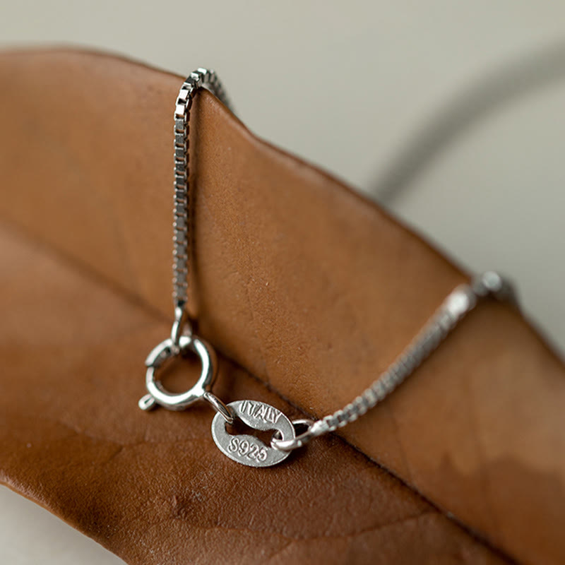 Spirituelle Halskette aus 999er Sterlingsilber mit Peace Joy Fu-Anhänger