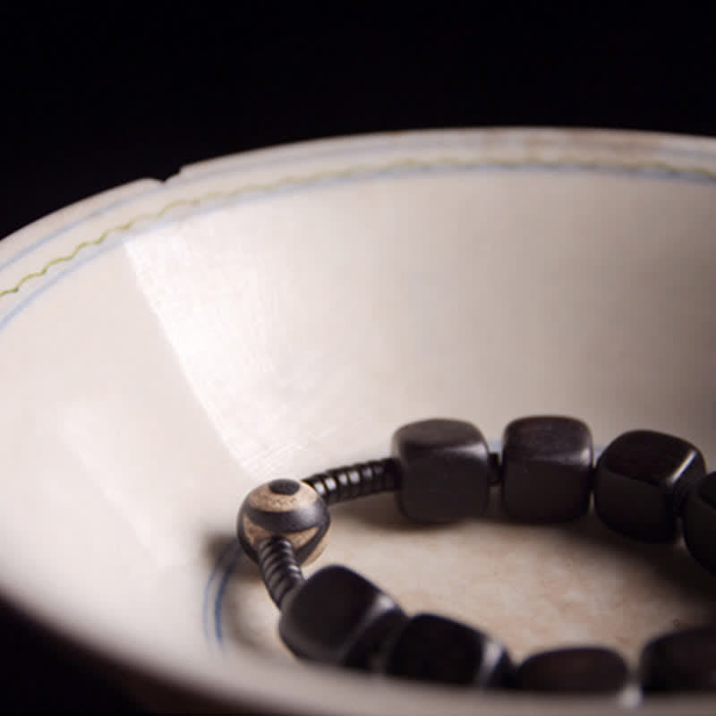 Unisex Ebenholz Dzi Perle spirituelles Armband für Stärke