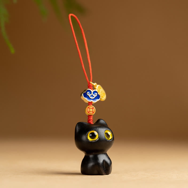 Kleiner Schutz-Schlüsselanhänger aus rotem Sandelholz und Ebenholz