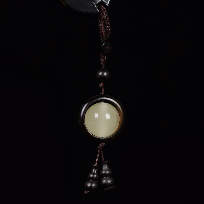 Schlüsselanhänger aus Ebenholz mit Peace-Zeichen | Leuchtperlen aus rotem und grünem Sandelholz