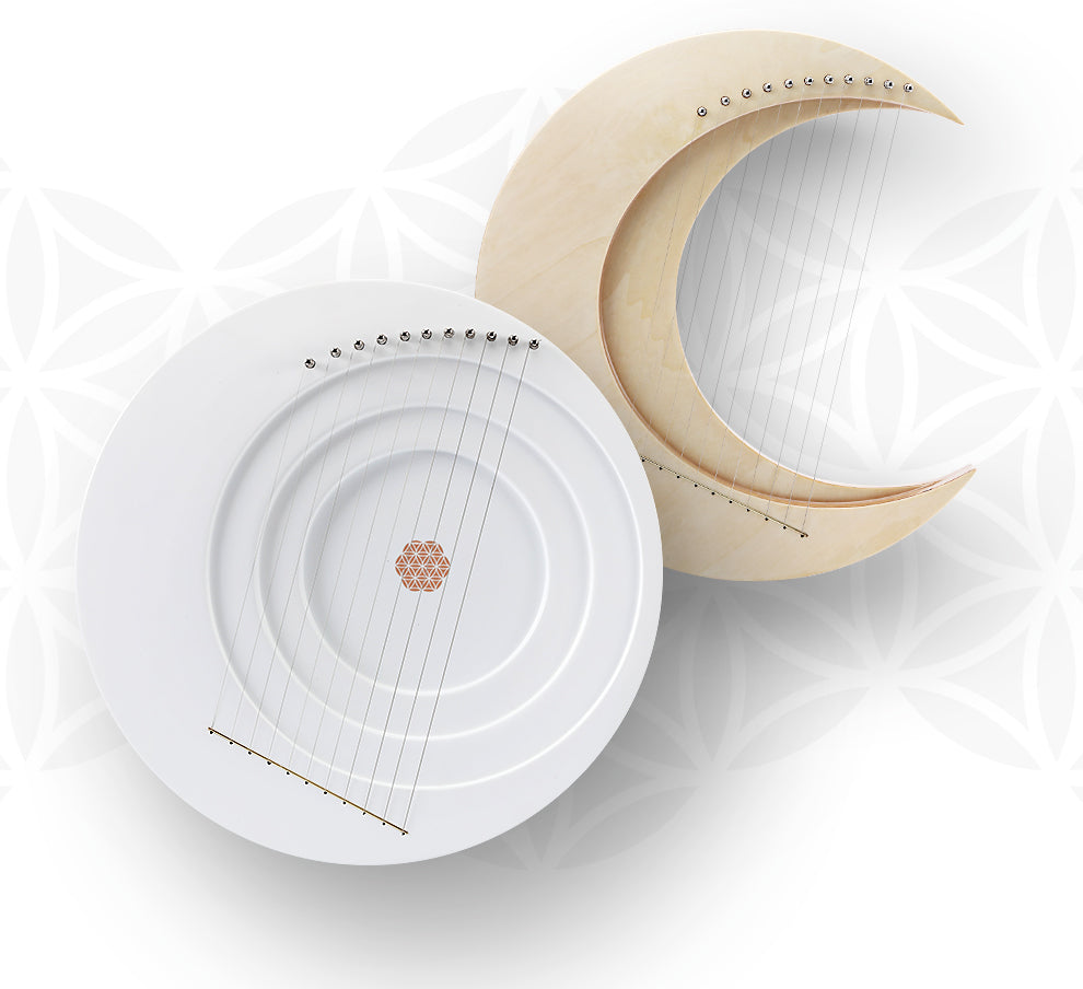 White circular plate with cream crescent moon decor on Full Moon Lyre Harp Instrument