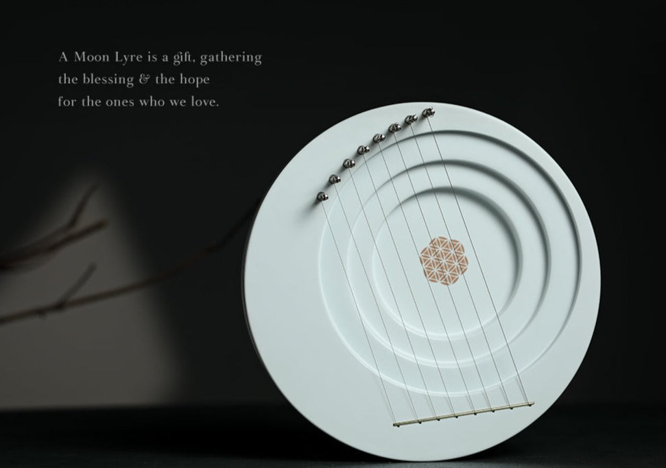 Circular white plate with geometric flower pattern for Full Moon Lyre Harp Instrument