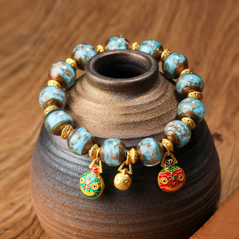 Goldfarbenes, schluckendes Biest, Liuli-Glasperlen-Spirituelles Armband, 12 mm