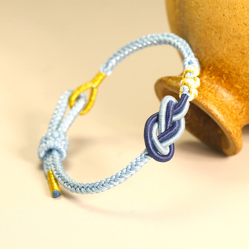 Handgefertigtes Peace-Knoten-Armband mit acht Fäden und roter Schnur