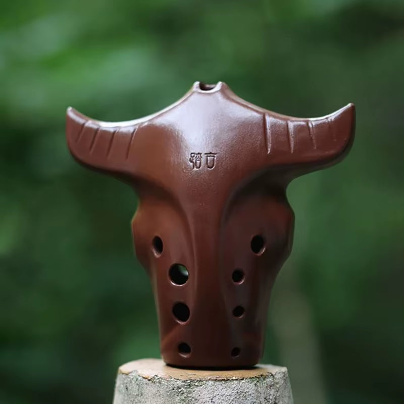 Brown ceramic bull head ocarina with breathing holes in Handmade 10-Hole Ceramic Xun Instrument