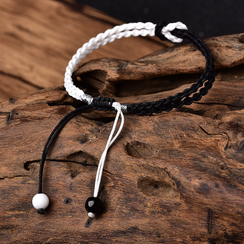 Handgemachtes schwarz-weißes Seil geflochtenes rotes Schnurarmband zum Schutz
