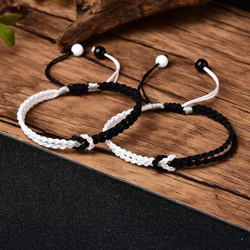 Handgemachtes schwarz-weißes Seil geflochtenes rotes Schnurarmband zum Schutz