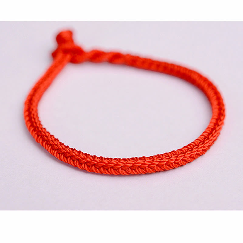 Handgemachtes rotes Armband mit acht Fäden und Friedensknoten