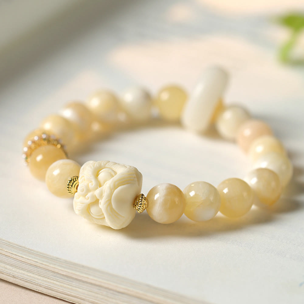 Elfenbeinfarbenes Frucht-Amber-Grau-Achat-Armband für Selbstvertrauen
