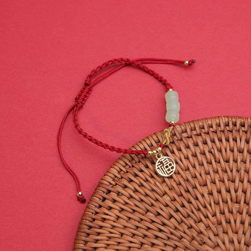 Jadeperlenarmband mit Fu-Anhänger an rotem Seil für Glück und Wohlstand