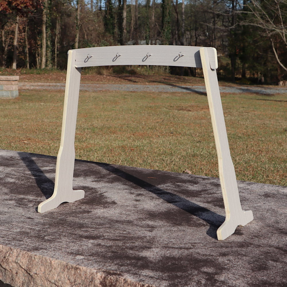 White wooden coat rack with four hooks on curved top beam for Large Stand for Melody Chimes