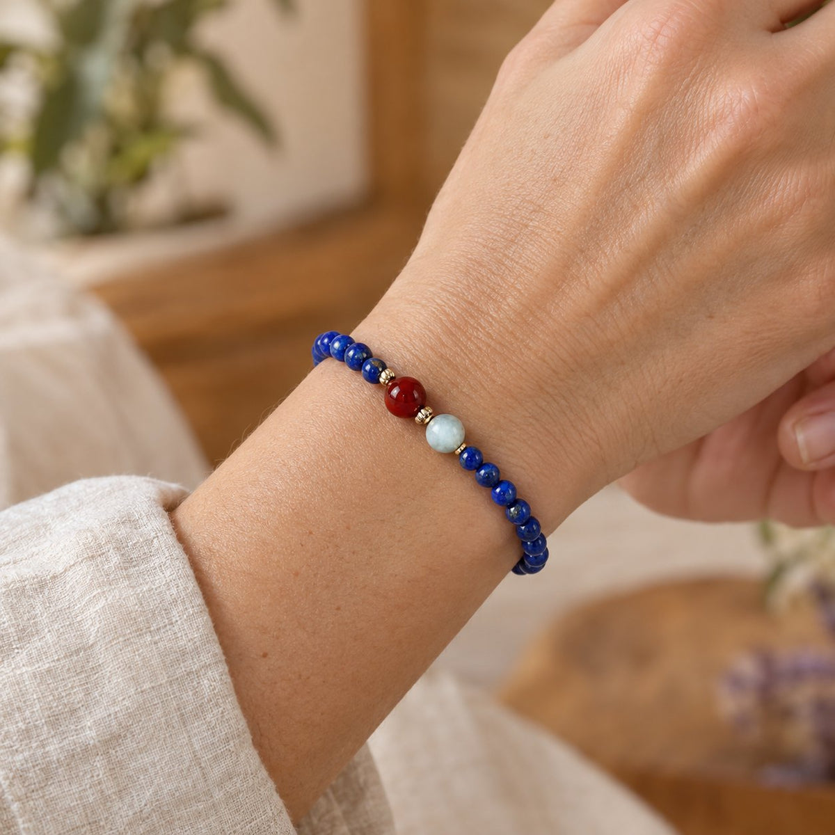 4mm Lazurite Bracelet for Meditation and Serenity, worn on the wrist by a woman