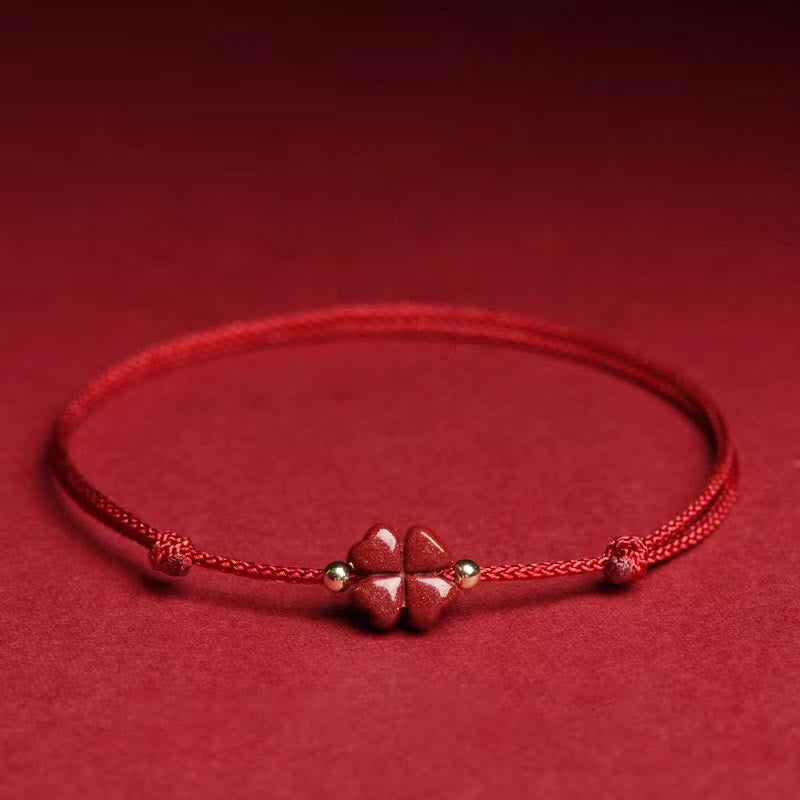 Natürliches zinnoberrotes Schnurarmband mit vierblättrigem Kleeblatt-Segen