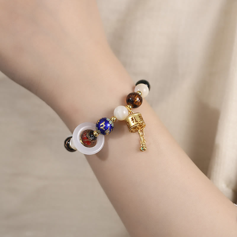 Om Mani Padme Hum Om Armband mit Tridacna & Sonnensteinen 14–16 cm