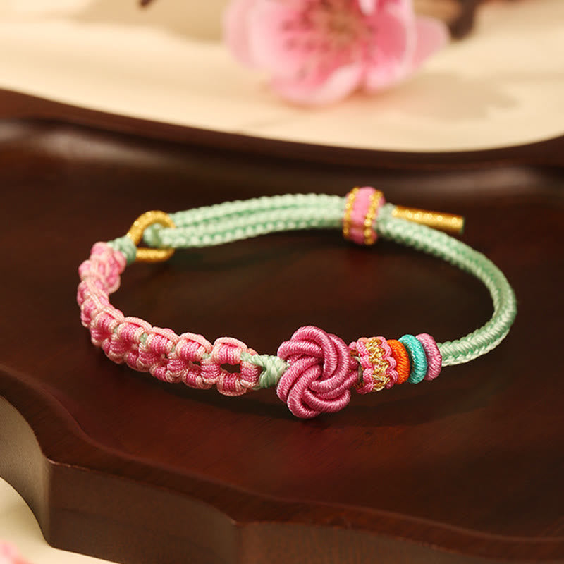 Pfirsichblütenknoten-Armband mit roter Schnur für Schutz und Liebe