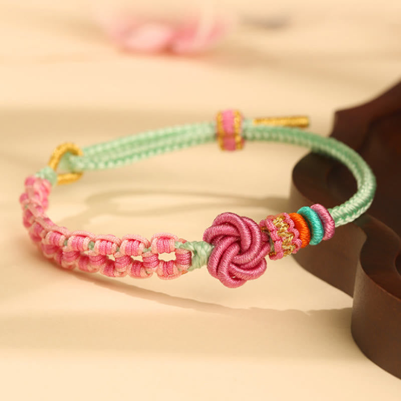 Pfirsichblütenknoten-Armband mit roter Schnur für Schutz und Liebe