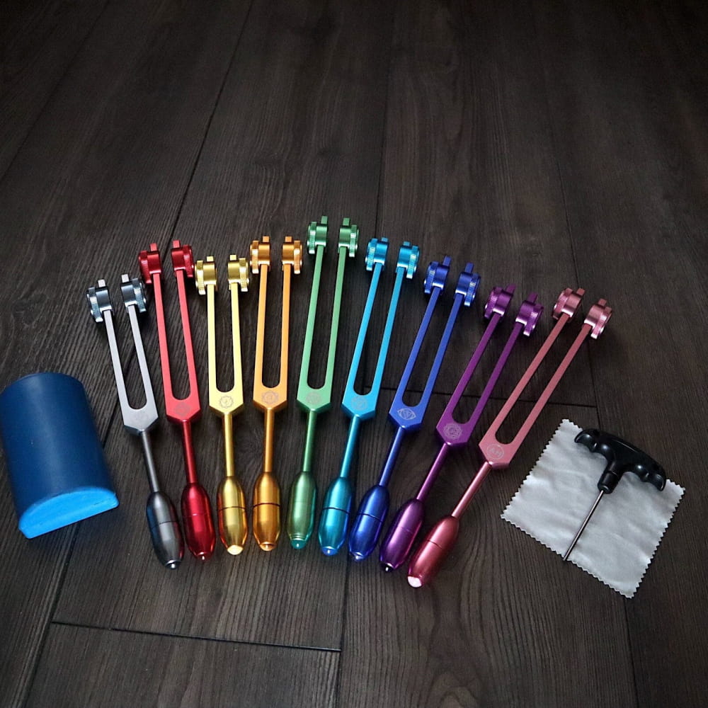 Rainbow-colored tuning forks in spectrum pattern for Crystal Massage Set