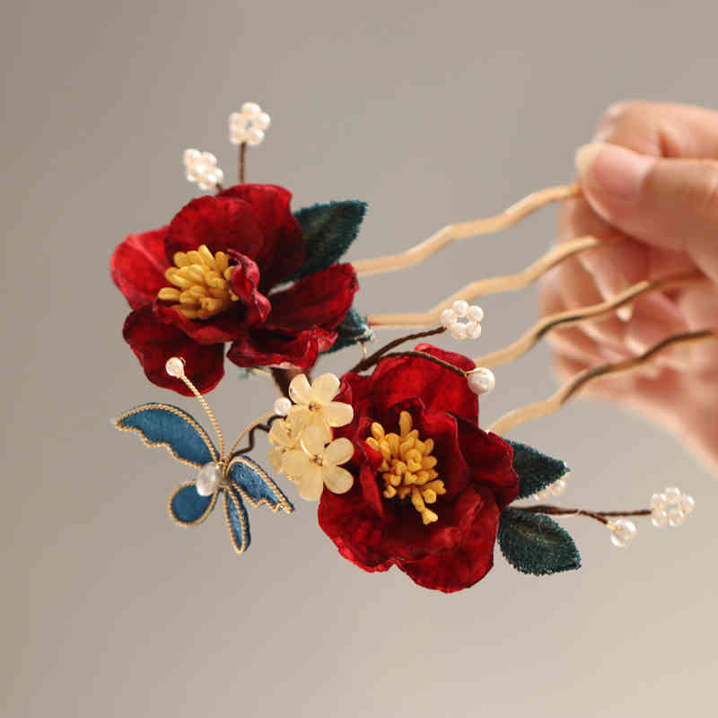 Chinesische Haarnadel mit rotem Kamelien-Schmetterling für Transformation und Hoffnung