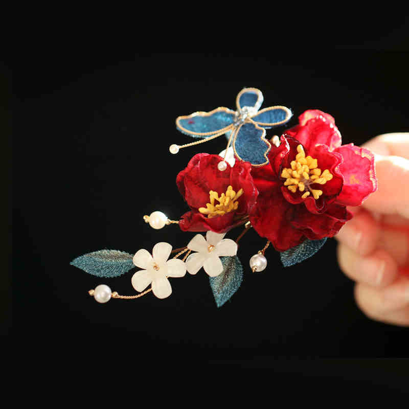 Chinesische Haarnadel mit rotem Kamelien-Schmetterling für Transformation und Hoffnung