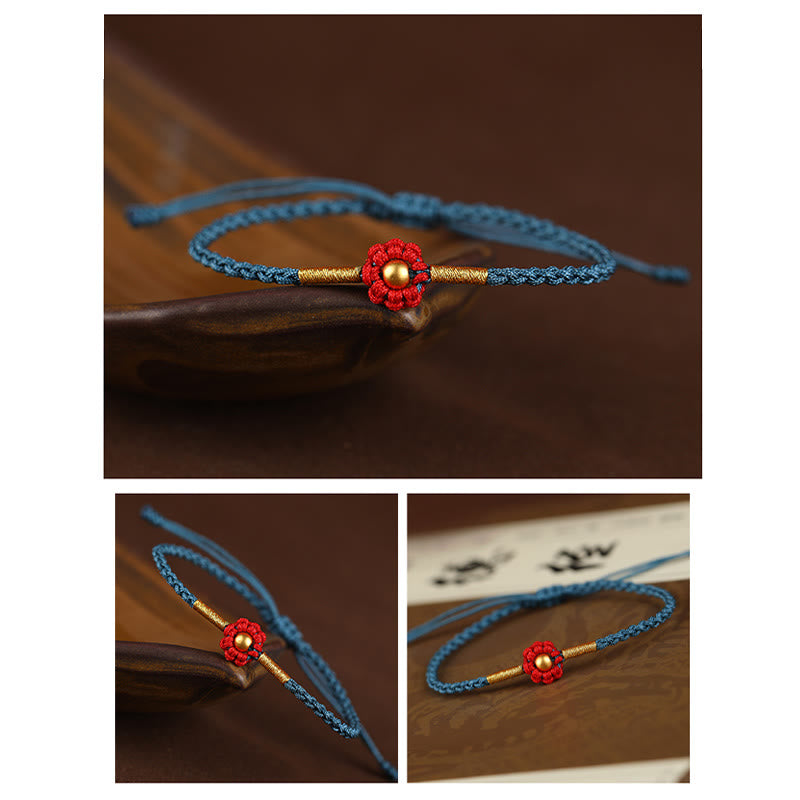 Rotes Schutzarmband mit goldener Blume