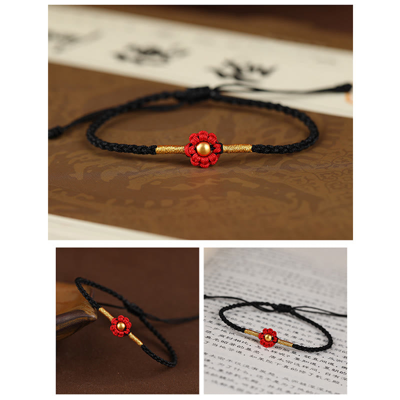 Rotes Schutzarmband mit goldener Blume