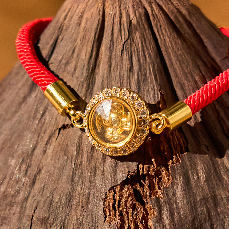 Drehbares Feng-Shui-Armband aus Kupfer mit roter Windmühlenschnur zum Schutz