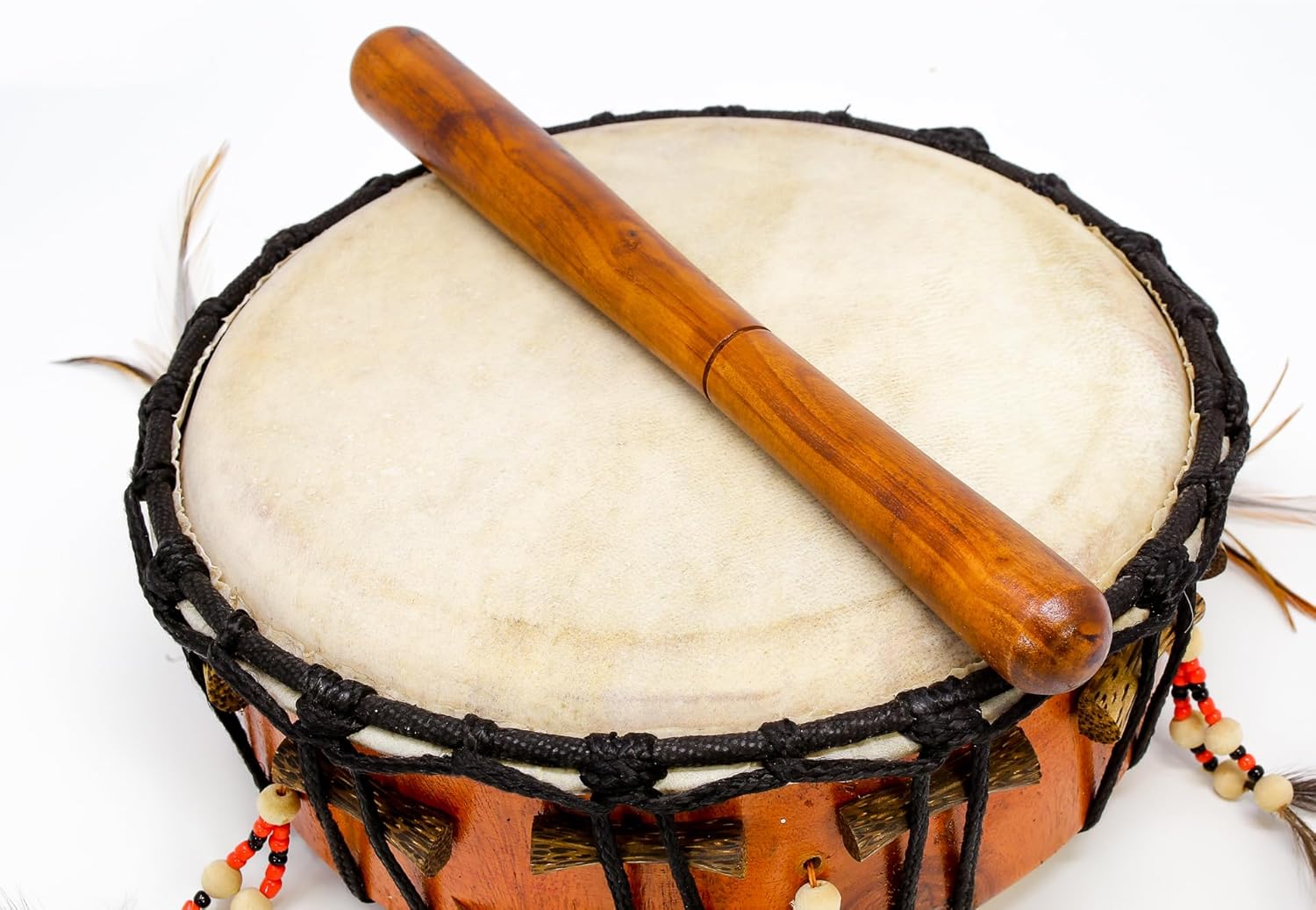 African Djembe drum with wooden beater on white goat skin frame instrument