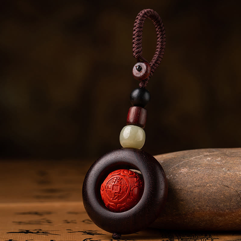 Schlüsselanhänger mit kleinem Blatt aus rotem Sandelholz „Om Mani Padme Hum“ zum Schutz