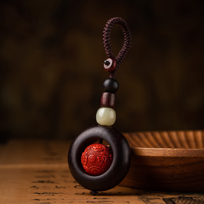 Schlüsselanhänger mit kleinem Blatt aus rotem Sandelholz „Om Mani Padme Hum“ zum Schutz