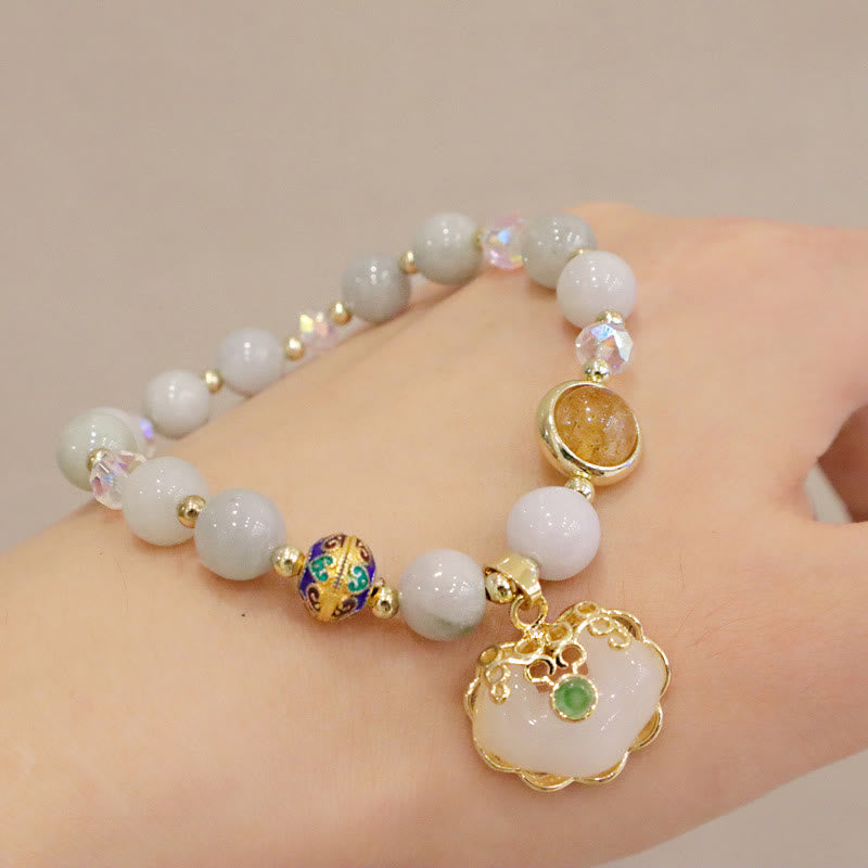 Heilarmband aus Erdbeerquarz mit chinesischem Schlossanhänger