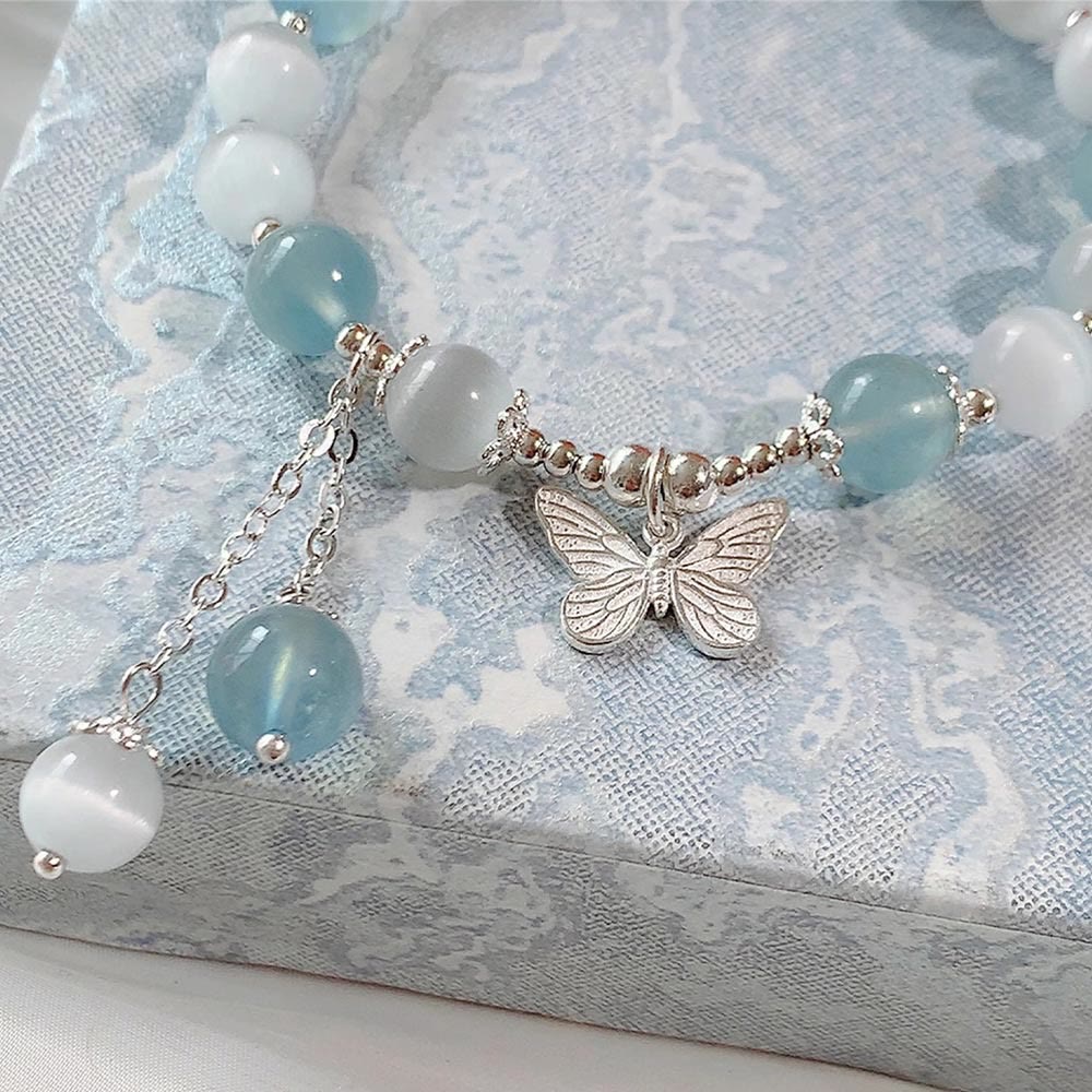 Unterstützen Sie das Aquamarin-Schmetterlings-Chakra-Armband mit heilenden Klängen