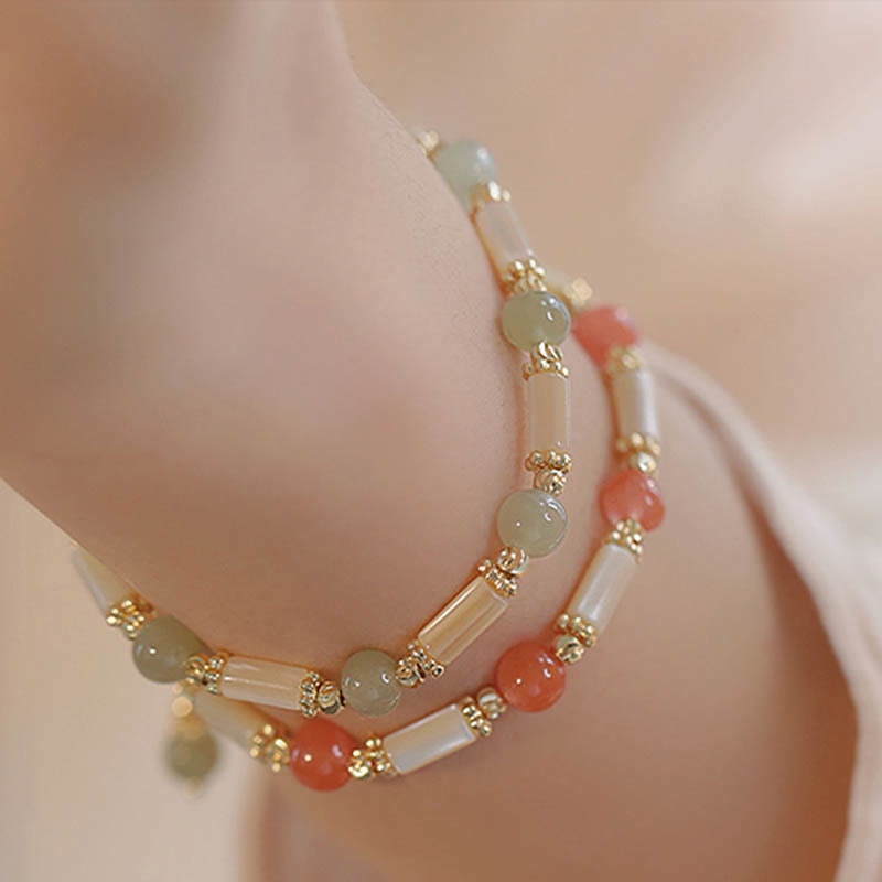 Segensarmband aus Tridacna-Stein und Hetian-Jade, 6 mm