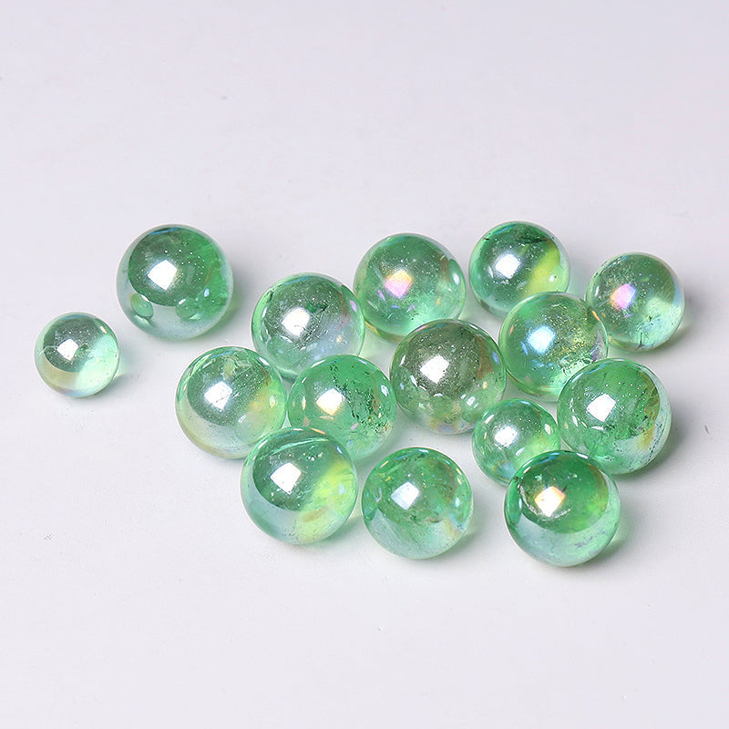 Translucent iridescent green glass marbles from Aura Green Crystal Sphere Healing Orb