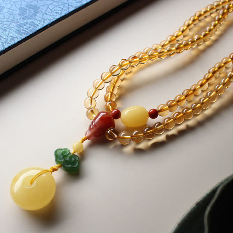 Mala-Armband mit 108 Perlen aus Citrin und Bernstein für den Frieden